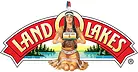 Logo featuring a Native American woman holding butter, with "Land O'Lakes" text and a scenic background of lakes and trees.